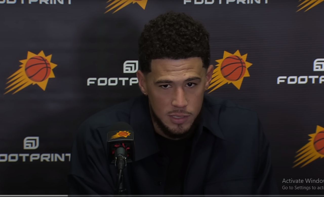 "Phoenix Suns' Star Devin Booker Left Out of Top 10 in NBA All-Star Voting – Fans Rally in Outrage!"